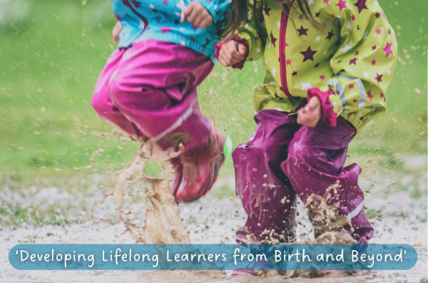 Two children jumping in a puddle