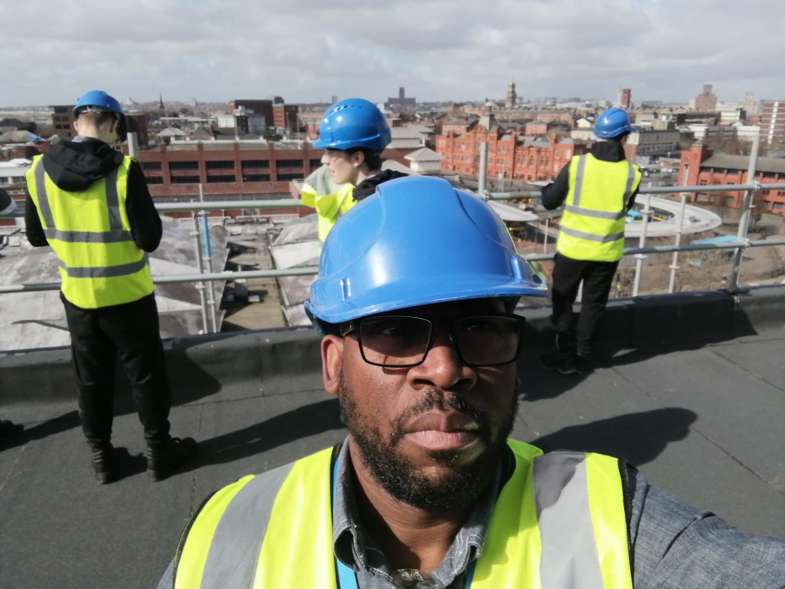 Photo of construction workers on rooftop -