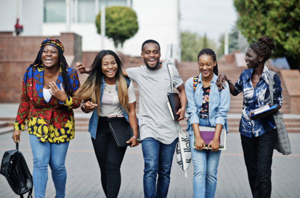 Picture of young males and females walking through streets of liverpool