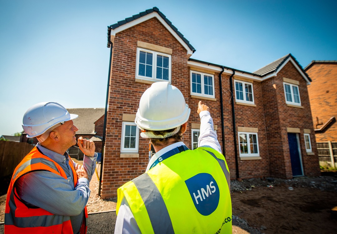 Two property maintenance experts in high visibility PPE