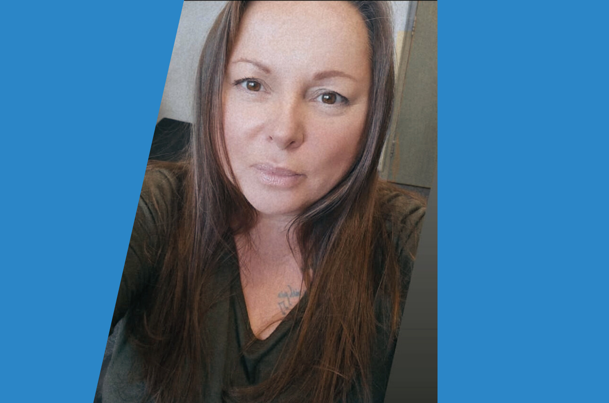 Female in office environment with b lie graphics